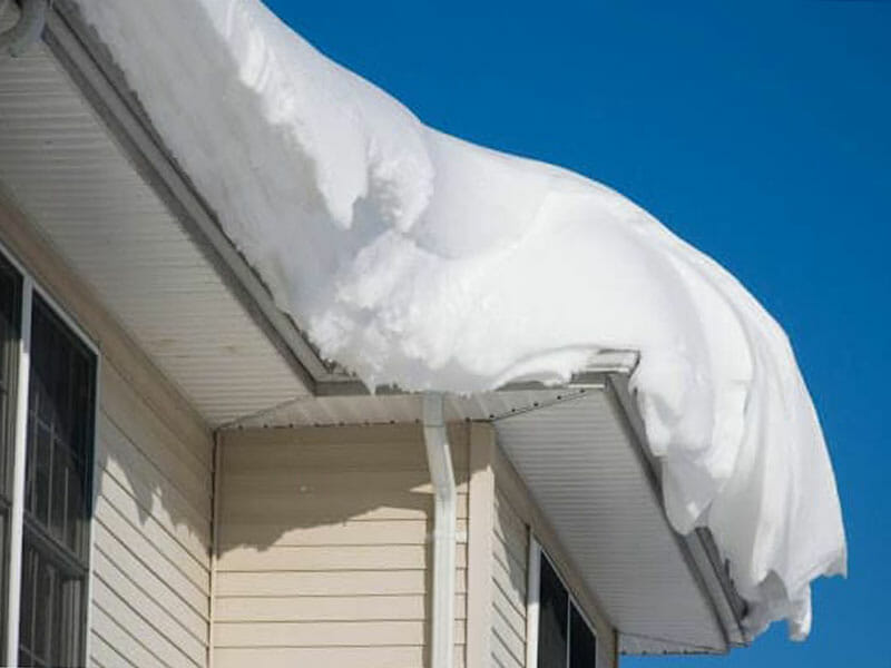 Snow on top of a roof